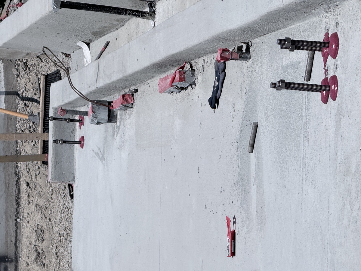 Anchor bolt embedment inspection along a foundation wall