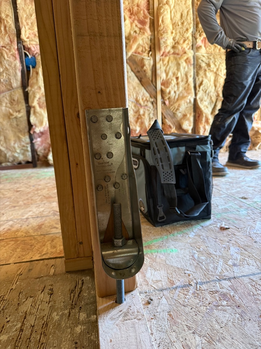 Seismic retrofit hold-down strap installation