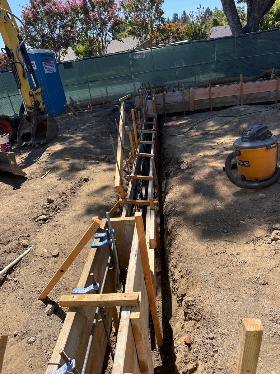 Foundation trench excavation prior to reinforcing steel placement